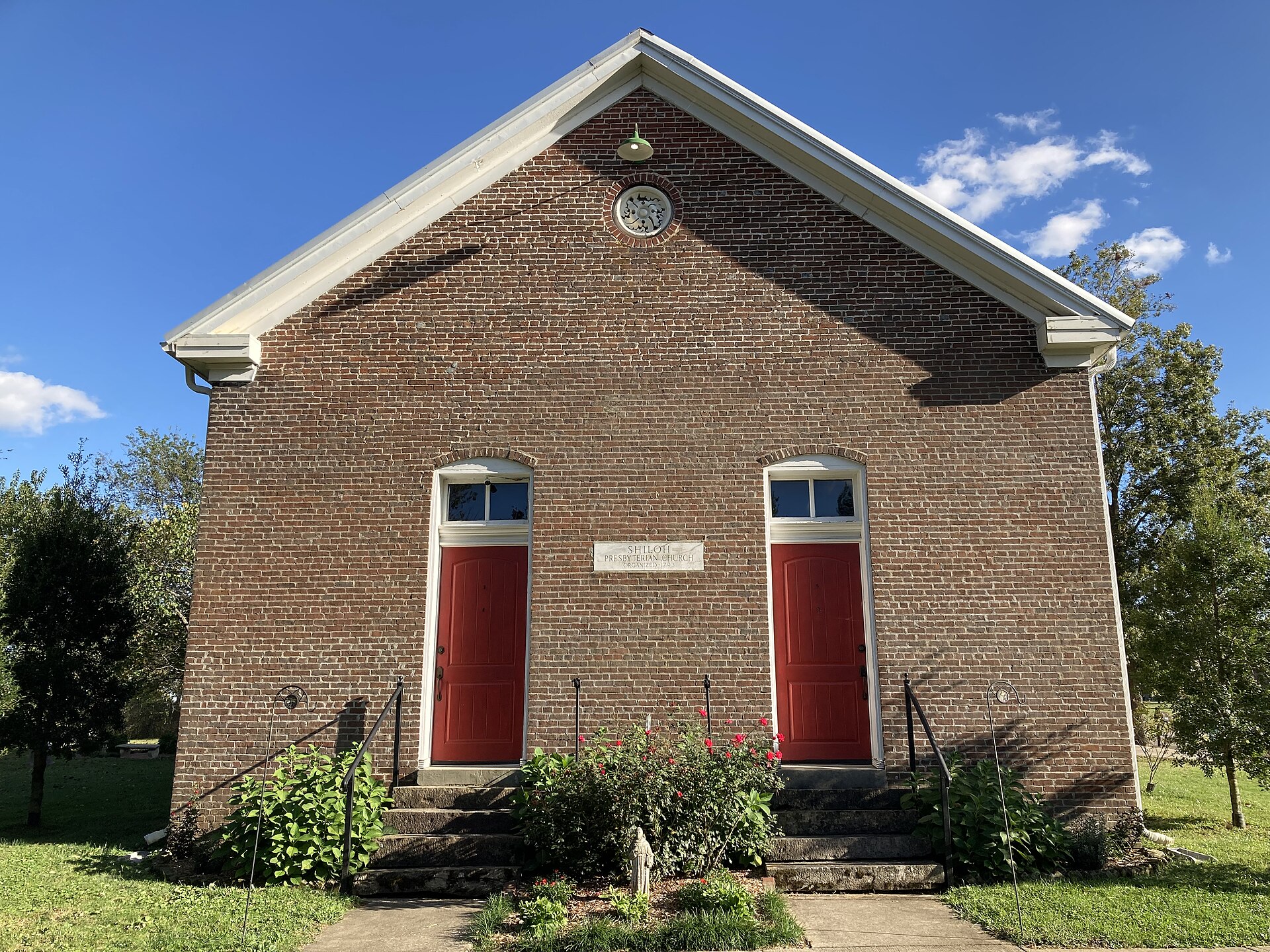 The red double doors at the entrance of Saint Michael’s historic sanctuary